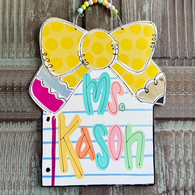 Notebook paper with pencil bow door hanger